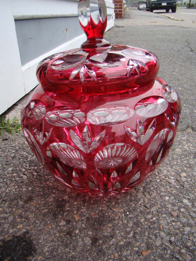 A magnificent vintage cranberry cut crystal punch bowl with lid